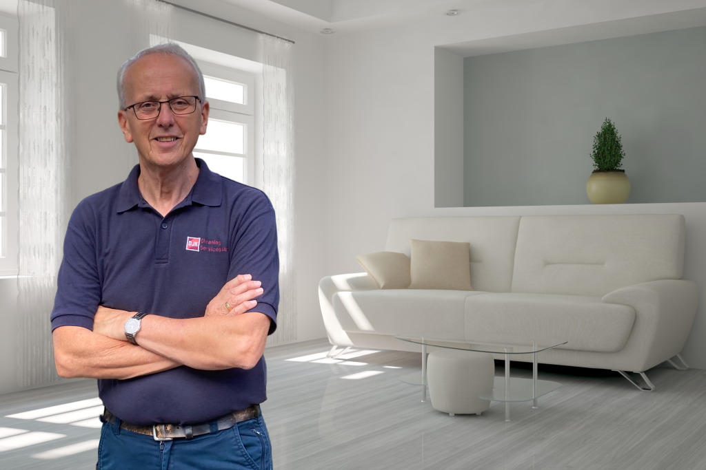David in a Bright, modern living room with a white sofa, mirror, and table, showcasing a clean and peaceful space
